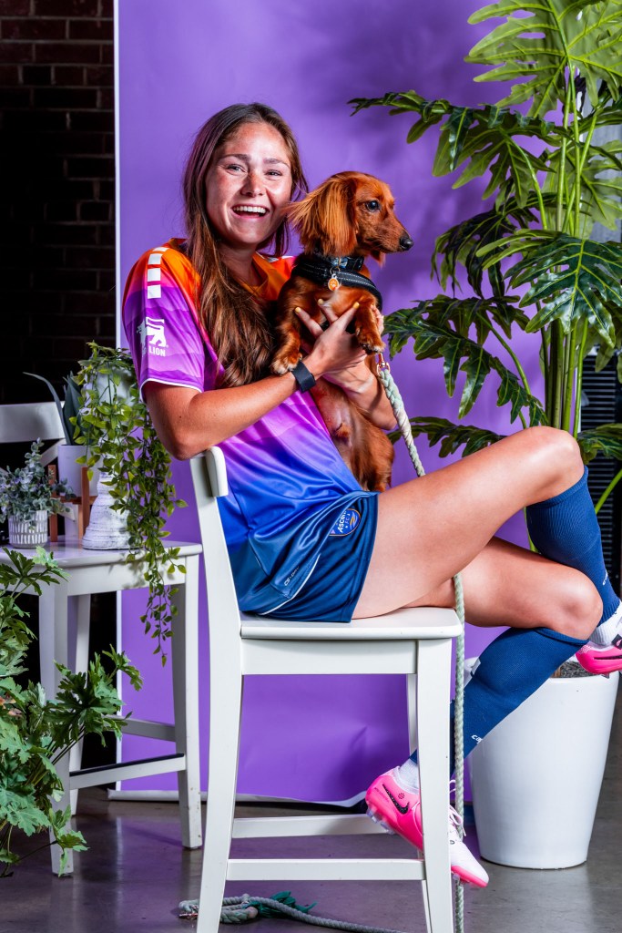 Carolina Ascent FC Player Emily Moxley with her dog. 