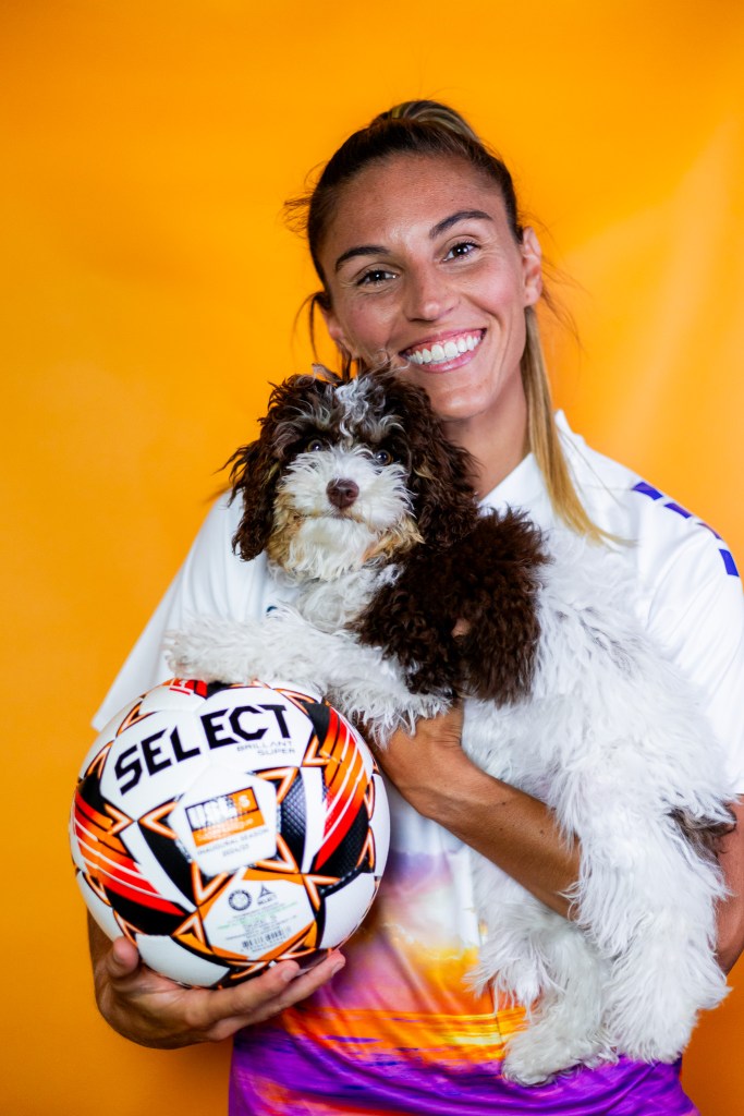 Carolina Ascent FC Player Vicky Bruce with her dog.