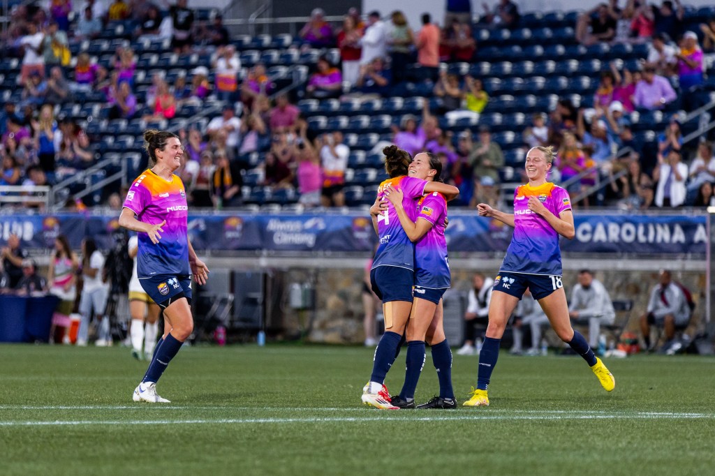 Eli Hutchinson celebrates her first half goal with her Carolina Ascent teammates against Spokane Zephyr FC